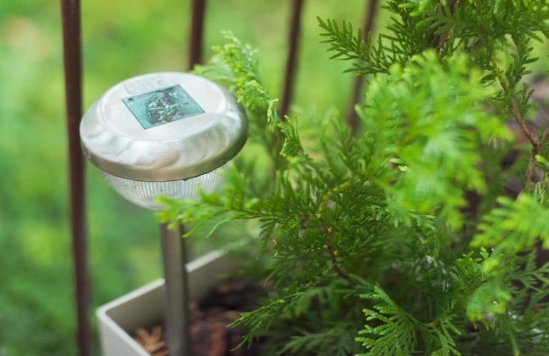 Lamp on the terrace in raindrops, garden lamp solar powered.